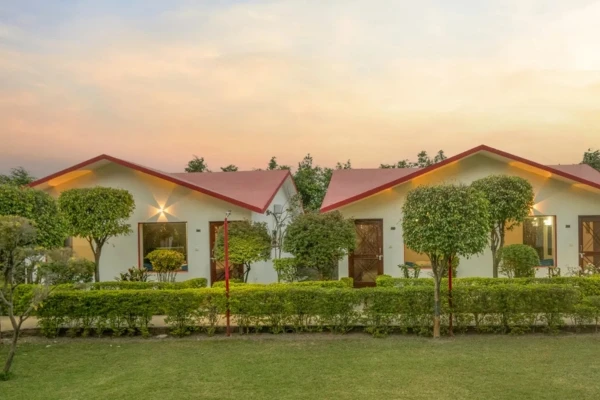 Corbett Holiday Forest Resort canopy-facing rooms near a waterhole
